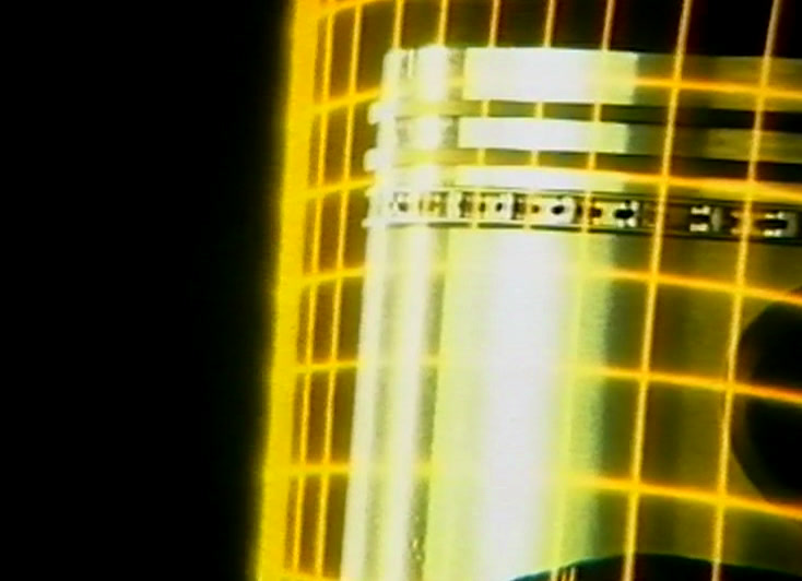 A yellow grid lies over a close-up of an engine piston and its rings.