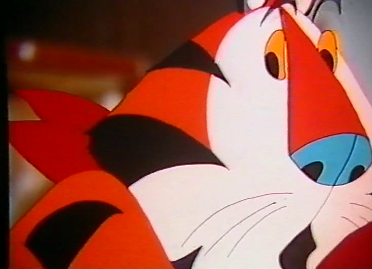 A very large close-up of the cartoon tiger's striped face and blue nose.