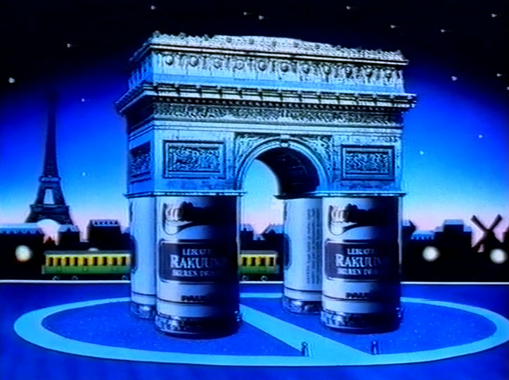 The Arc de Triomphe and a tower lit blue at night, two spice tins standing below.