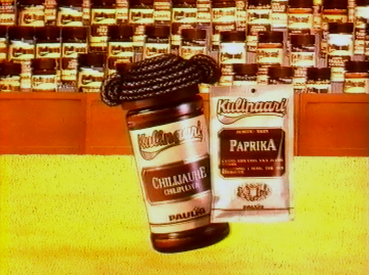 Two spice jars tip forward above ranks of identical jars on a yellow ground.