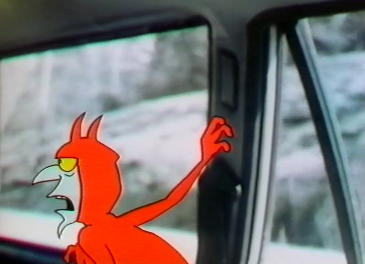 The red devil beside the door glass, arm raised, winter road outside.