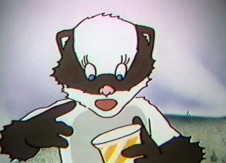 Holding a pot in one paw, the badger gestures with the other, snow behind.