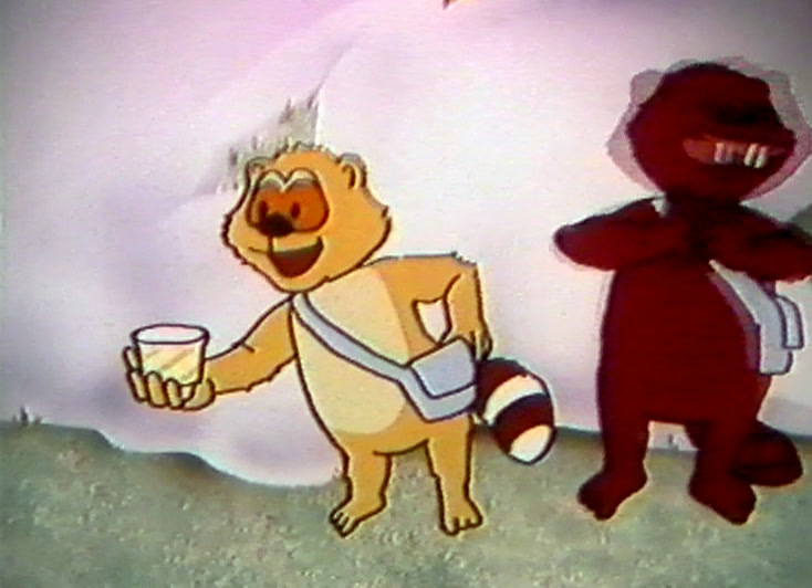 The tan cub holds out a white pot; the red beaver stands with folded arms.