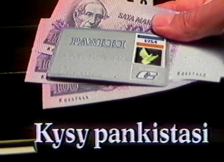 A hand slides a payment card over two banknotes, white subtitle beneath on black.