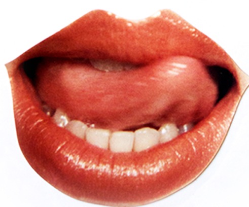 An airbrushed photograph of glossy red lips, the tongue licking the upper lip, cut out against white.