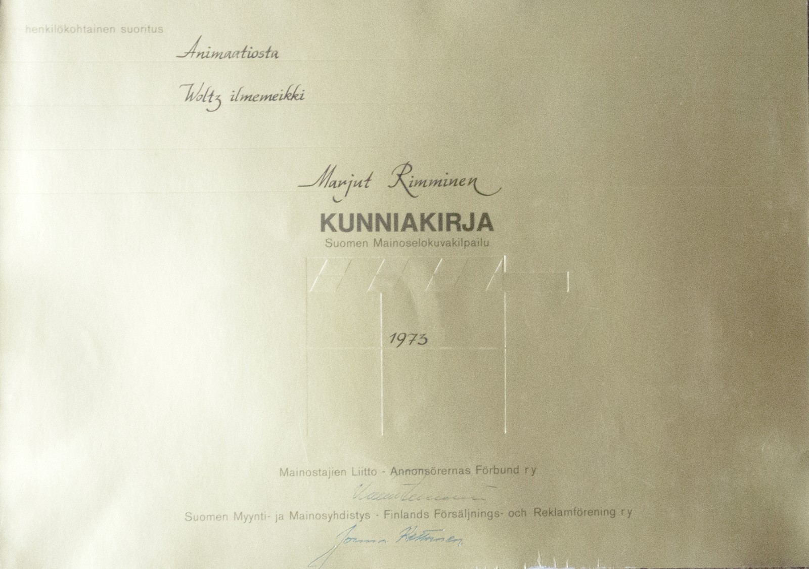 A gold Kunniakirja certificate from the Finnish advertising film competition of 1973, made out in ink to Marjut Rimminen for animation, Woltz ilmemeikki.