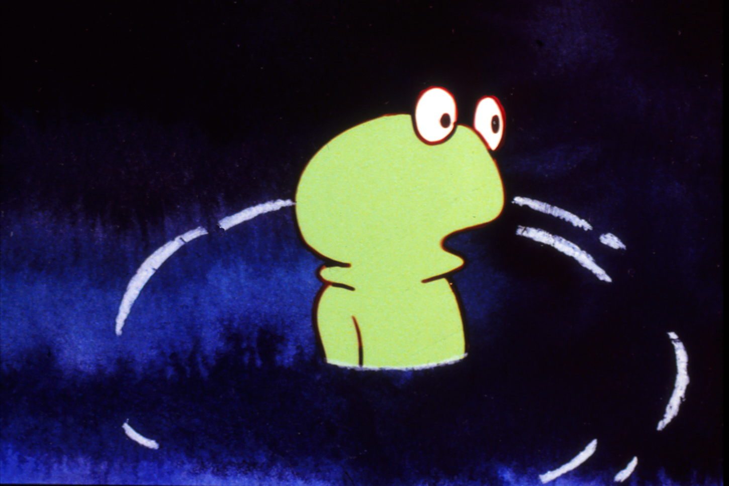 Still from The Frog King, a green frog emerges from dark blue water surrounded by ripples