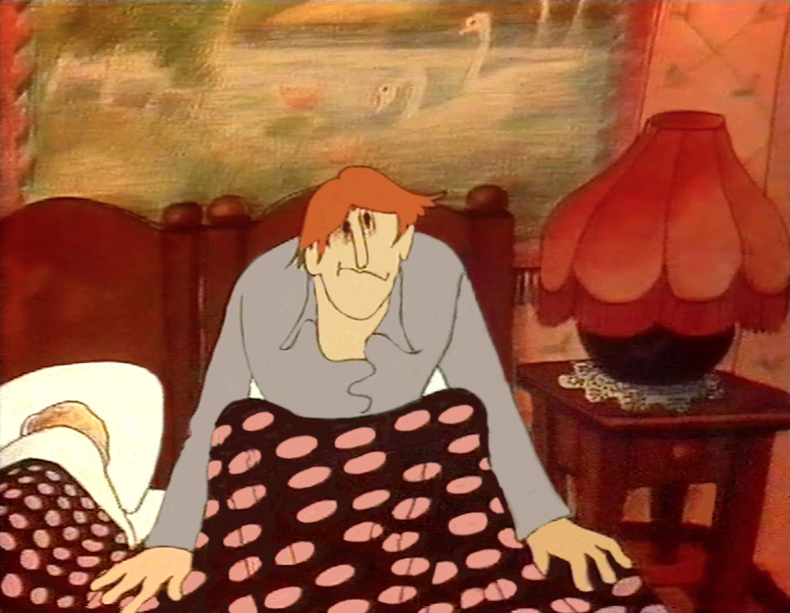 Kellogg still, the man sits up in bed, worn and unshaven, his hands spread on the spotted quilt beside a red lamp