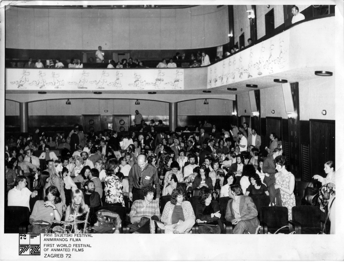 Marjut Rimminen and Dick Arnall sit in the front row on the left in a crowded festival auditorium with a balcony, Zagreb, 1972