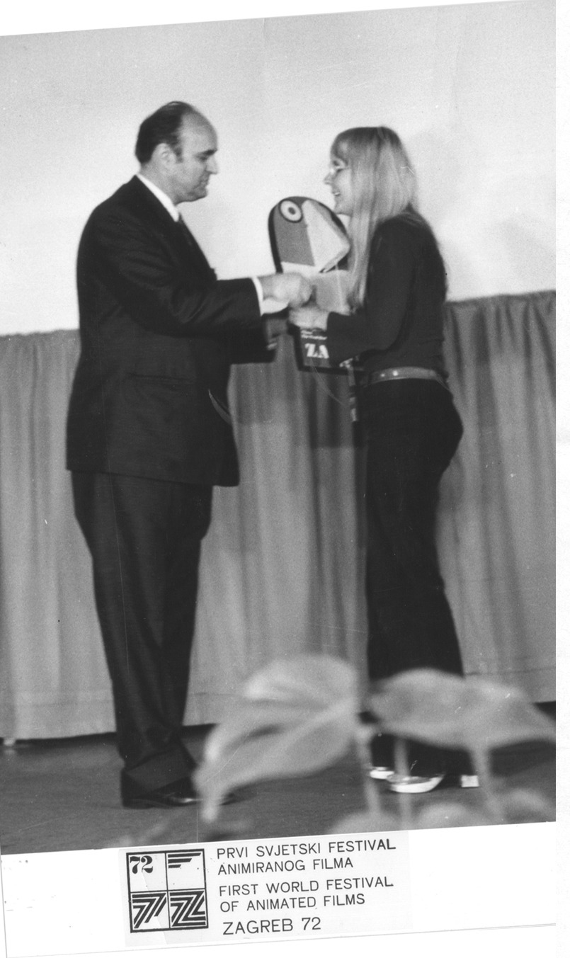 Marjut Rimminen receives her prize on stage at Zagreb in 1972 from a man in a dark suit; the festival mark and ZAGREB 72 printed below.